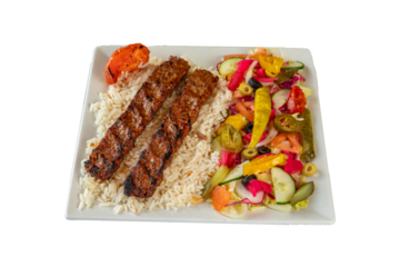 Delicious adana kebab served with rice and fresh salad on a white square plate on transparent background