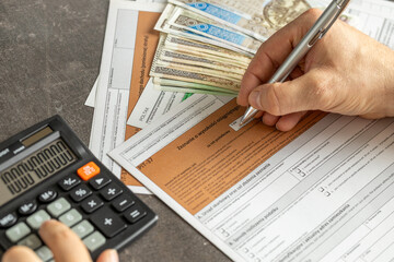 Completing the tax return called PIT. Annual tax settlement in Poland.