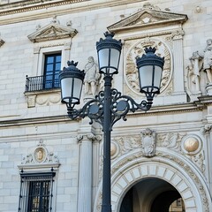 Ornate Street Lamp in Front of Historic Building
