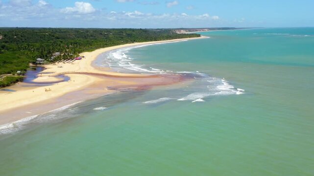 Aerial view of a beautiful tropical beach with turquoise water and white sand