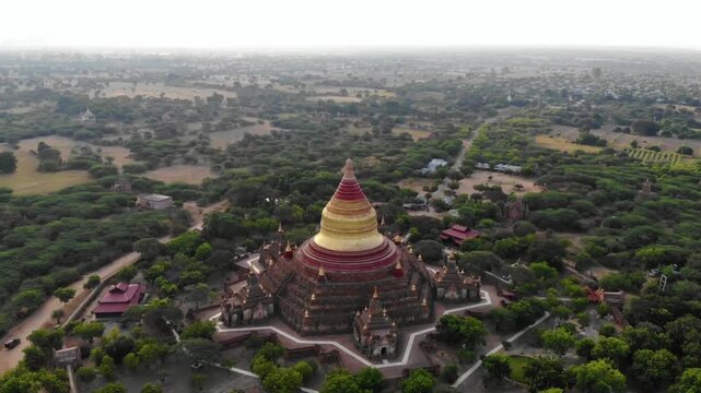 Aerial view of the ananda temple in bagan, myanmar surrounded by lush trees