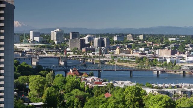 An aerial view of the cityscape of portland, oregon on a sunny day