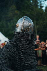 knight in helmet and chain mail, ancient knightly armor