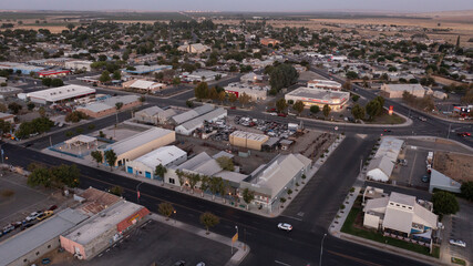 Coalinga, California, Mexico - September 2, 2024: Twilight evening traffic passes through the heart...
