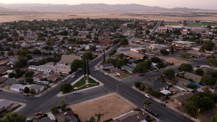 Coalinga, California, Mexico - September 2, 2024: Twilight evening traffic passes through the residential neighborhood district.
