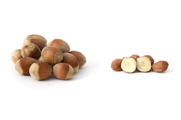 Whole hazelnuts scattered on a clean white background, showcasing their natural texture and rich brown color, perfect for food and health concepts.
