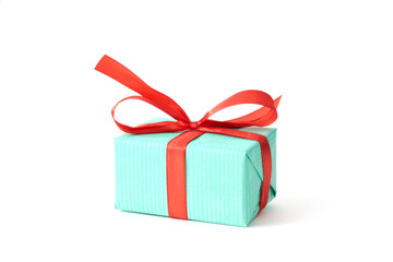 A gift box adorned with a decorative bow, set against a crisp white background, ideal for holidays and special moments.