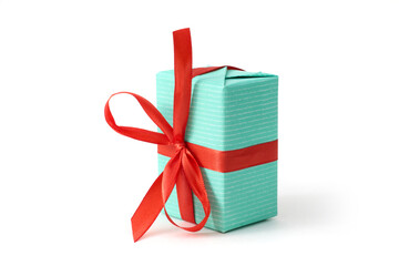 A gift box adorned with a decorative bow, set against a crisp white background, ideal for holidays and special moments.