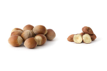 Whole hazelnuts scattered on a clean white background, showcasing their natural texture and rich brown color, perfect for food and health concepts.