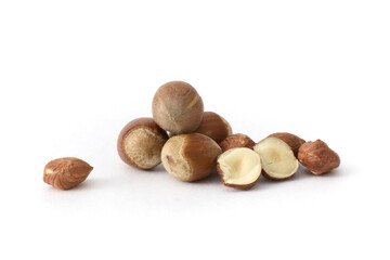 Whole hazelnuts scattered on a clean white background, showcasing their natural texture and rich brown color, perfect for food and health concepts.