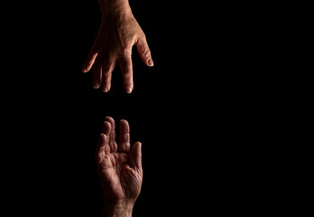 Hand is helping older hand. Help hands holding together representing friendship, partnership, help and hope, donation. Helping old