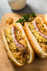 Homemade Beer Bratwursts on a Bun with Sauerkraut