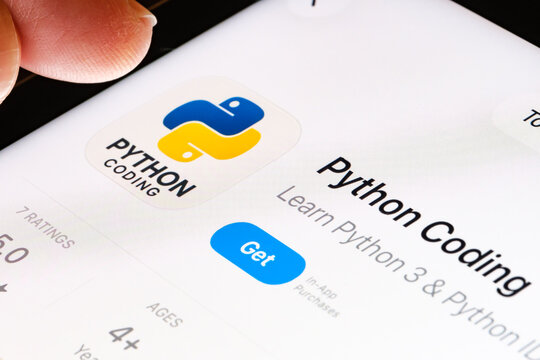 Python coding practice on iPad with Apples new Liquid Glass updated app design iOS 26 developer tool listing for Python in App Store. Stafford, United Kingdom, September 25, 2025.