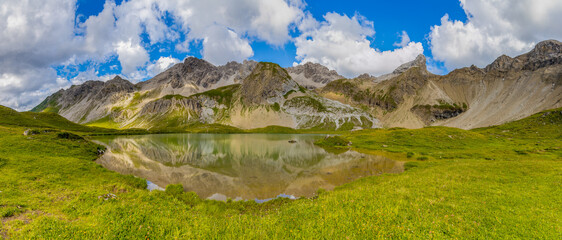 Panorama of Alps mountains on a sunny day. High resolution widescreen panorama of mountain...