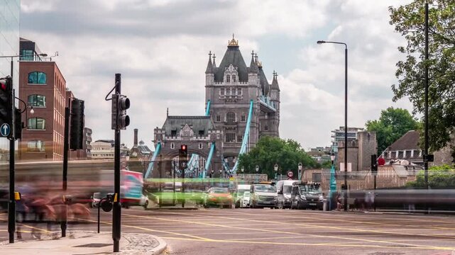 Tower bridge in london seen from a street with traffic