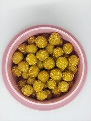 Onde onde sesame balls in pink bowl, traditional indonesian snack