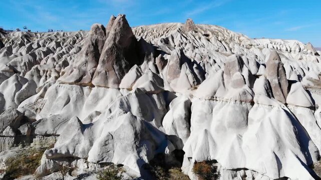 Bizarre rock formations and fairy chimneys in cappadocia, turkey under blue sky