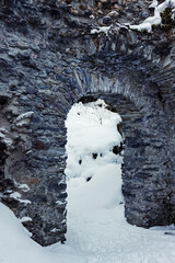 France - Peisey-Nancroix - Mine Palace - Ancient stone arch in snowy ruins