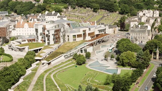 Aerial view of the scottish parliament building and holyrood park in edinburgh