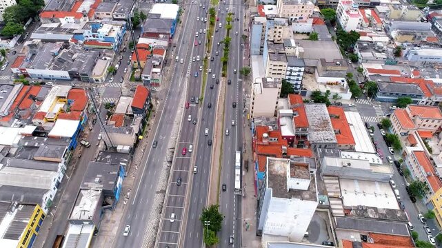 Aerial view captures the urban landscape of a city with bustling traffic