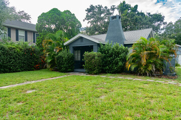 Peaceful suburban landscape with vibrant foliage and Mediterranean architecture.