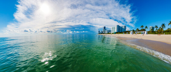 South Florida Beach Life. Urban Skyline Meets Relaxing Ocean Shore