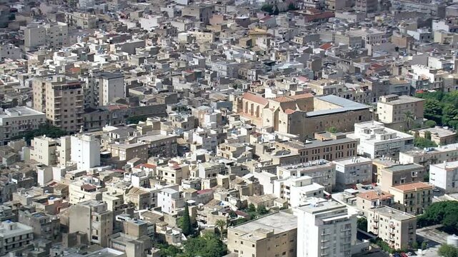 Aerial view of a densely populated city with buildings and streets