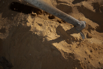 Water poured onto cement mixture at construction site