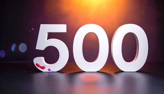 Bold white numbers "500" stand out against a dark gradient background with a blurred, golden glow in the distance. A few paint splatters dot the base
