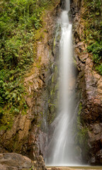 Silky waterfall in rainforest rocks
