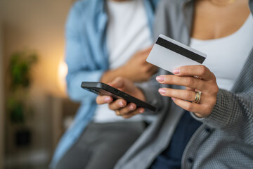 Couple using smart phone for online shopping and payment