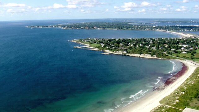 Aerial view of a coastal town with beaches and blue ocean on a sunny day