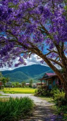 Obraz premium A picturesque pathway leads through a vibrant landscape, shaded by a profusion of purple blossoms, towards a charming village nestled in a valley of rolling hills.