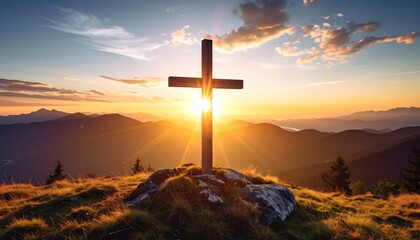 Sunset illuminates a wooden cross atop a mountain