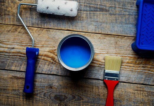preparation for painting with  can of blue paint top view