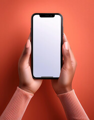 A woman hands hold a smartphone with a blank screen against a bright coral background. Generative AI.
