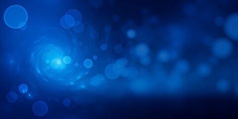 Abstract blue background with bokeh lights and glowing swirl effect design