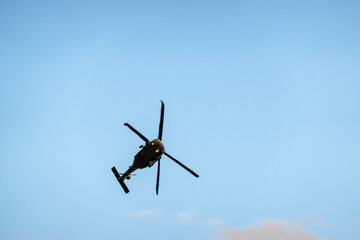 Military helicopter UH-60 in flight