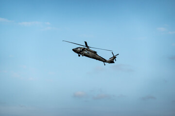 Military helicopter UH-60 in flight