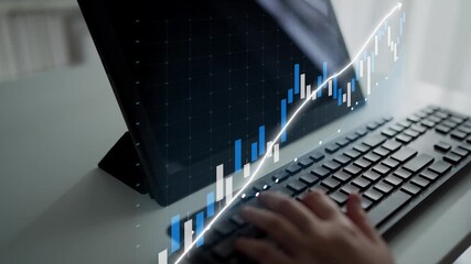 A close-up of hands typing on a keyboard with a financial data display, highlighting stock market trends and emphasizing the significance of digital analytics in business. Copula - Powered by Adobe
