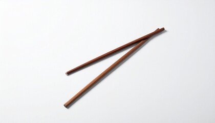 Classic wooden chopsticks, a fundamental utensil for East Asian dining, elegantly arranged on a pristine white background, representing culinary traditions and healthy eating