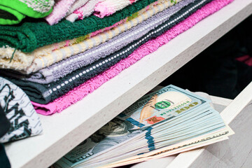 a stash of cash in a closet with underwear kept at home for emergencies