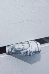 a stash of cash in a closet with underwear kept at home for emergencies