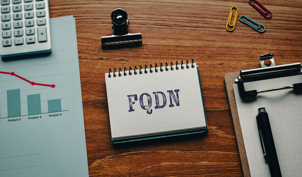 There is notebook with the word FQDN. It is an abbreviation for Fully Qualified Domain Name as eye-catching image.