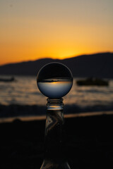 Crystal Ball on a Bottle Sunset at Sea, Lensball on Sand and Sunset