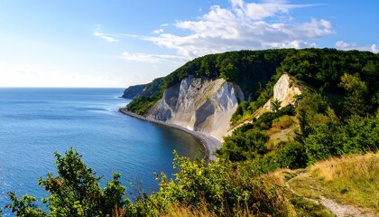 Majestic white cliffs meet the azure sea under a bright sky with scattered clouds