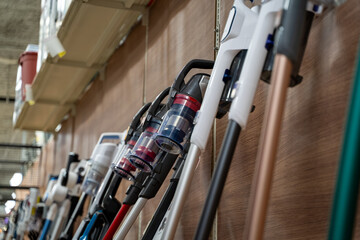 Close up view of cordless stick vacuum cleaners on display.