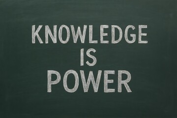 Inspirational quote knowledge is power written in chalk on a dark blackboard for education and learning concepts