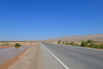 Desert road sand dunes in Xinjiang, China