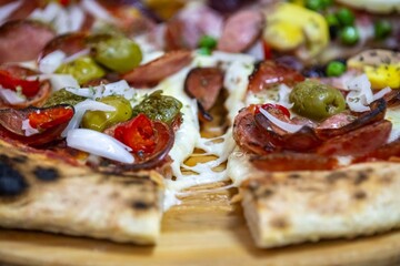 The most acclaimed, traditional and popular Brazilian pizza, half pepperoni calabresa and half Portuguese